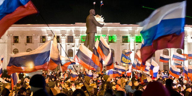 Pro-Russians celebrate in Simferopol, Ukraine, after polls closed in Crimea's referendum on seceding from Ukraine. Photo / AP