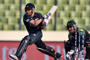 New Zealand captain Brendon McCullum attempts a reverse sweep as Pakistan's wicketkeeper Kamran Akmal takes his position during their Twenty20 World Cup warm-up match in Dhaka. Photo / AP