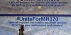 A woman reads messages for passengers aboard a missing Malaysia Airlines plane, at a shopping mall in Petaling Jaya, near Kuala Lumpur. Photo / AP