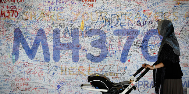 A board displaying messages of hope for passengers aboard the missing Malaysia Airlines plane at Kuala Lumpur International Airport. Photo / AP