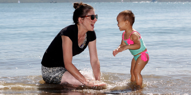A happy Hayley McGregor, of Papatoetoe, has fun in the water with 22-month-old Reign Kent. Photo / Chris Gorman