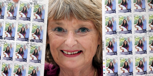 Jeanette Littlefair at the NZ Post stamps and collectables centre in Wanganui with the commemorative stamps featuring the Duke and Duchess of Cambridge and Prince George. Photo/Stuart Munro
