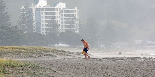 A brave swimmer treads a lonely path at Mount Main Beach on Saturday. Photo/Andrew Warner