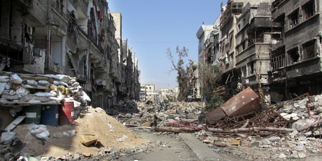 The fighting and damage to parts of Syria, such as this street in Damascus, have displaced 6.5 million Syrians inside and 2.5 million outside the country, the United Nations says. Photo / AP
