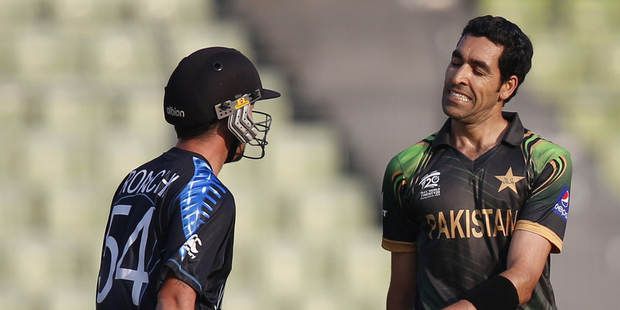 Pakistan's bowler Umar Gul, right, reacts after taking the wicket of New Zealand batsman Luke Ronchi. Photo / AP