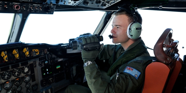 Australian Air Force pilot Russell Adams scans the ocean thousands of kilometres from land. Photo / Getty Images