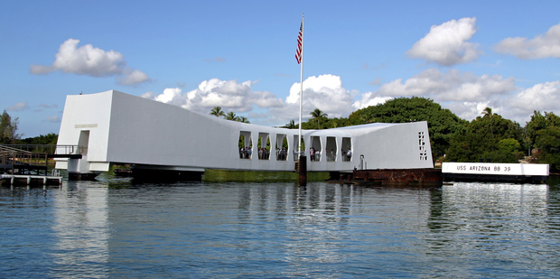 The USS Arizona memorial lies atop the wreckage, some of which protrudes from the sea. Photo / Thinkstock