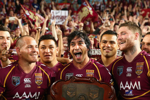 Johnathan Thurston of the Maroons and team mates celebrate winning game three of the ARL State of Origin series in July 2013. Photo / Getty Images