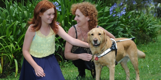 Lisa Reid, with daughter Maddison, now has Heidi as her guide dog.