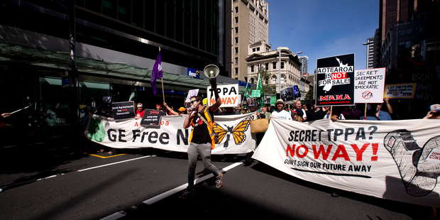 Protest down Queen Street, Auckland over the government's TPPA deal. Photo / Dean Purcell