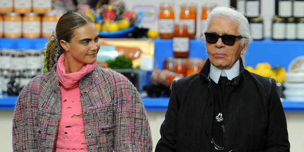 Fashion Designer Karl Lagerfeld (right) and model Cara Delevingne appear at the end of the runway during the Chanel show as part of the Paris Fashion Week. Photo / Getty Images