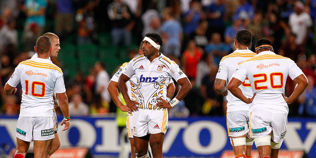 Asaeli Tikoirotuma of the Chiefs looks dejected after his side's first defeat of 2014. Photo / Getty Images
