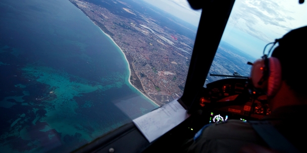 An Australian Air Force Orion completes its 11-hour search on Monday for the missing plane. Picture / AP