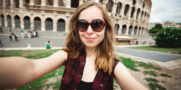 Snapping selfies in front of famous landmarks has become de rigueur for today's travellers. Photo / Yulia Mayorova