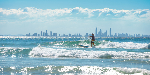 Paddle-boarding is popular in Currumbin.