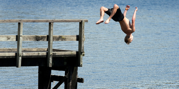 The Indian summer keeps the tempratures warm enough for swimming at Lake Pupuke in Takapuna. Photo / Brett Phibbs