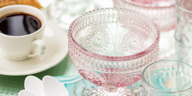 Pink ice cream glasses, small glasses, espresso cup and saucer, cut glass dish, heart dish (set of 3), French key, green tray, English tile all from Romantique. Photo / Babiche Martens