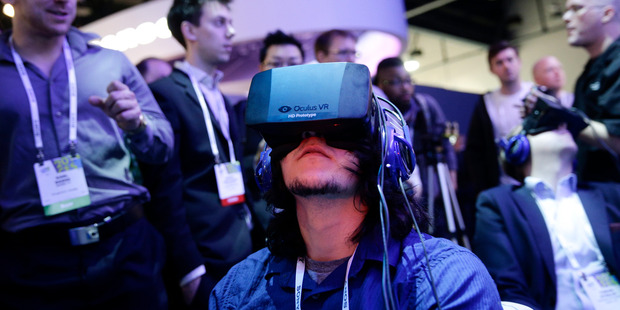 People play a video game wearing Oculus Rift virtual reality headsets the International Consumer Electronics Show, in Las Vegas. Photo/ AP