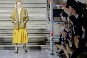 Designer Miuccia Prada acknowledges applause following the presentation of the Miu Miu ready-to-wear fall/winter 2014-2015 fashion collection presented in Paris. Photo / Jacques Brinon.