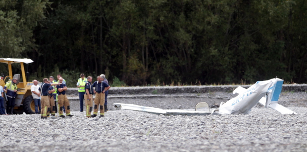 Emergency workers at the site of the air crash in the Ngaruroro River. A visitor from Britain and a local instructor died in the crash. Photo / Paul Taylor