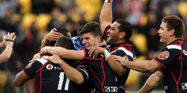 Warriors players celebrate the third try of Glen Fisiiahi during the round four NRL match between the New Zealand Warriors and the Wests Tigers. Photo / Getty Images.