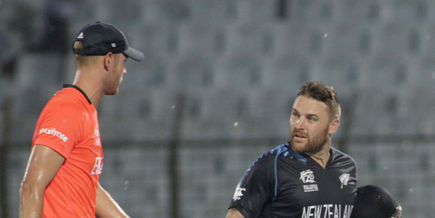 England skipper Stuart Broad and New Zealand captain Brendon McCullum have words as play was suspended during their World Twenty20 clash. Photo / AP