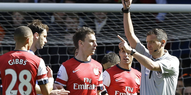Kieran Gibbs was sent off against Chelsea after Alex Oxlade-Chamberlain handled the ball in the box. Photo / AP