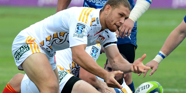 Tawera Kerr-Barlow gets a pass away during the Chiefs' draw with the Bulls in Pretoria. Photo / Getty