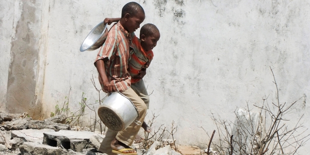 Starving children were used as pawns. Photo / AP