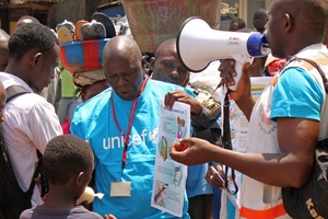 Health workers teach people about the Ebola virus, which is spread by contact with victims or their body fluids. Photo / AP