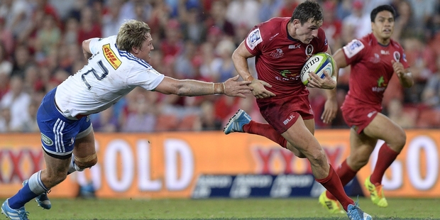 Mike Harris breaks away for the Reds. Photo / Getty Images