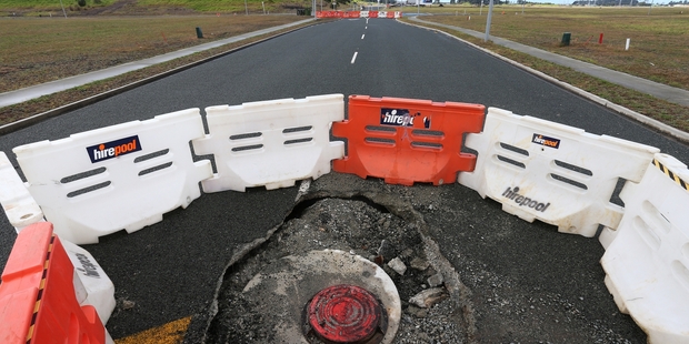 WHO PAYS? A failed stormwater system on the new Marsden City development has resulted in manholes collapsing and the road being closed. PHOTO/MICHAEL CUNNINGHAM