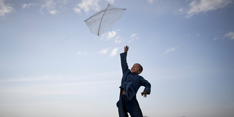 An Afghan boy flies his kite on a hill overlooking Kabul, Afghanistan. Photo / Anja Niedringhaus
