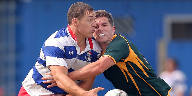 Rangiuru centre Elijah Nicholas passes in the tackle of Mount Maunganui's Matt Golding in the opening round of Baywide club rugby. Photo/Andrew Warner