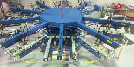 A Diamondback 9 head automatic printer.