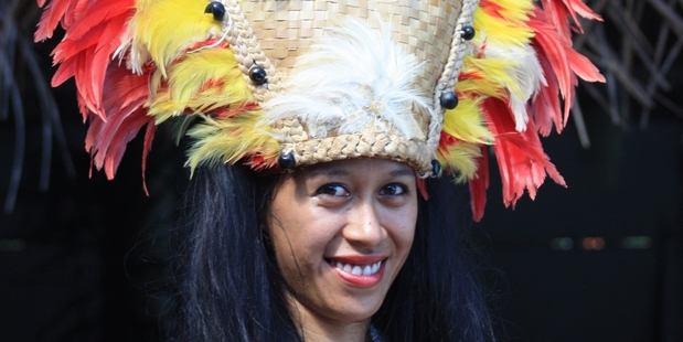 A local woman on Moorea with a dramatic head dress. Photo / Paul Rush