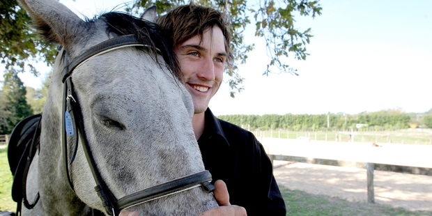 Josh Flannagan, 20, has found his place tending and looking after horses at the Trinity Valley riding school after years of bullying at school. Photo/Ruth Keber