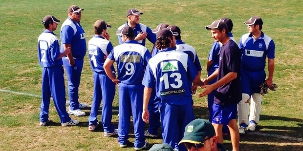 TACTICS: Greytown gather for a final team talk before taking the field against Eastern Suburbs.