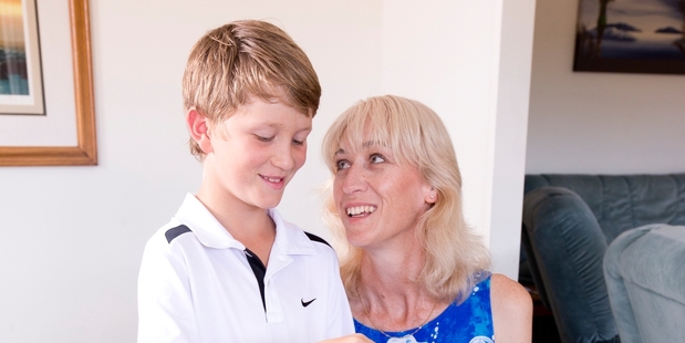 Louise Acfield and son Brendan use YouTube tutorials to hone their Rainbow Loom skills. Photo / Dean Purcell