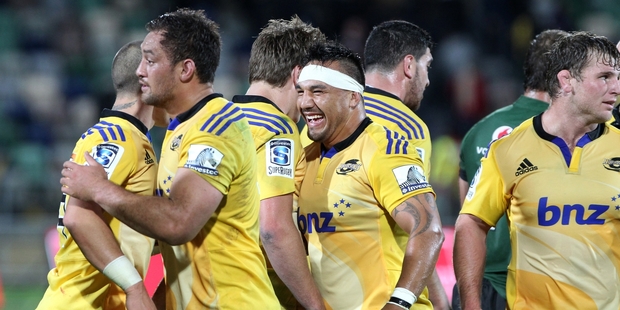 Hurricanes and Magpies hooker Ash Dixon (headband) and player-of-the-match Jack Lam, left, display their elation after the final whistle. Photo/Duncan Brown