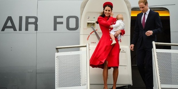 Britain's Prince William and his wife Catherine, carrying baby Prince George, arrive at the international airport in Wellington.
Photo / Mark Tantrum, AFP
