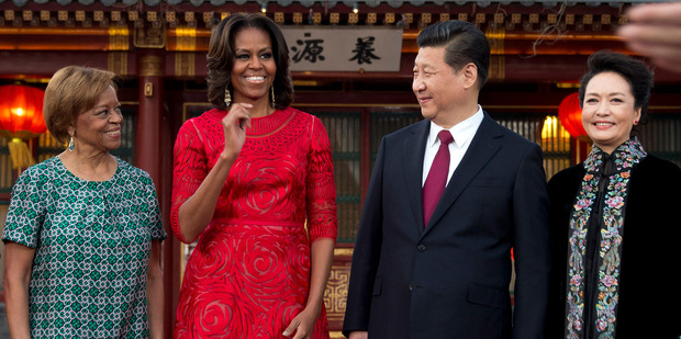 US first lady Michelle Obama, second from left, her mother Marian Robinson, left, share a light moment with Chinese President Xi Jinping and his wife Peng Liyuan. Photo / AP