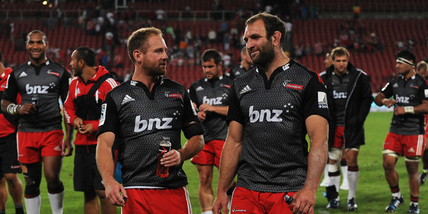 George Whitelock and Andy Ellis of Crusaders leaving the field after defeating Lions during the Super Rugby match between Lions and Crusaders. Photo / Getty Images.