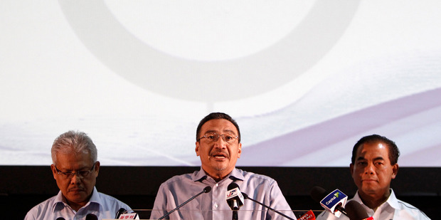 Malaysian acting Transport Minister Hishammuddin Hussein, centre. Photo / AP
