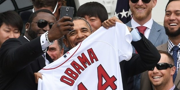 Red Sox Designated Hitter David Ortiz (L) taking the controversial selfie with US President Barack Obama. Photo / AP