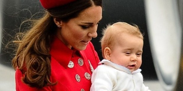 Catherine, the Duchess of Cambridge, carries baby Prince George upon their arrival at the international airport in Wellington. Photo / AFP