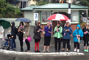Royal watchers along Oriental Parade wait patiently for a glimpse of the Duke and Duchess of Cambridge Prince William and Catherine and Prince George. Photo / Teuila Fuatai