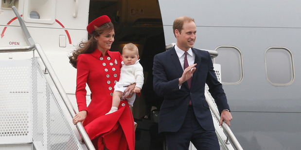 The Duke and Duchess of Cambridge with Prince George disembarking from the RNZAF jet after arriving at Wellington Airport. Photo / Mark Mitchell