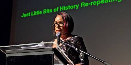 Australian artist-curator Fiona Foley giving the keynote address in London.
