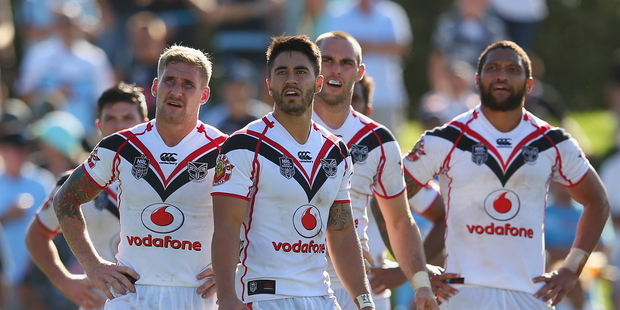 Sam Tomkins, Shaun Johnson, Simon Mannering and Manu Vatuvei of the Warriors look dejected after a Sharks try during the round five NRL match. Photo / Getty Images.